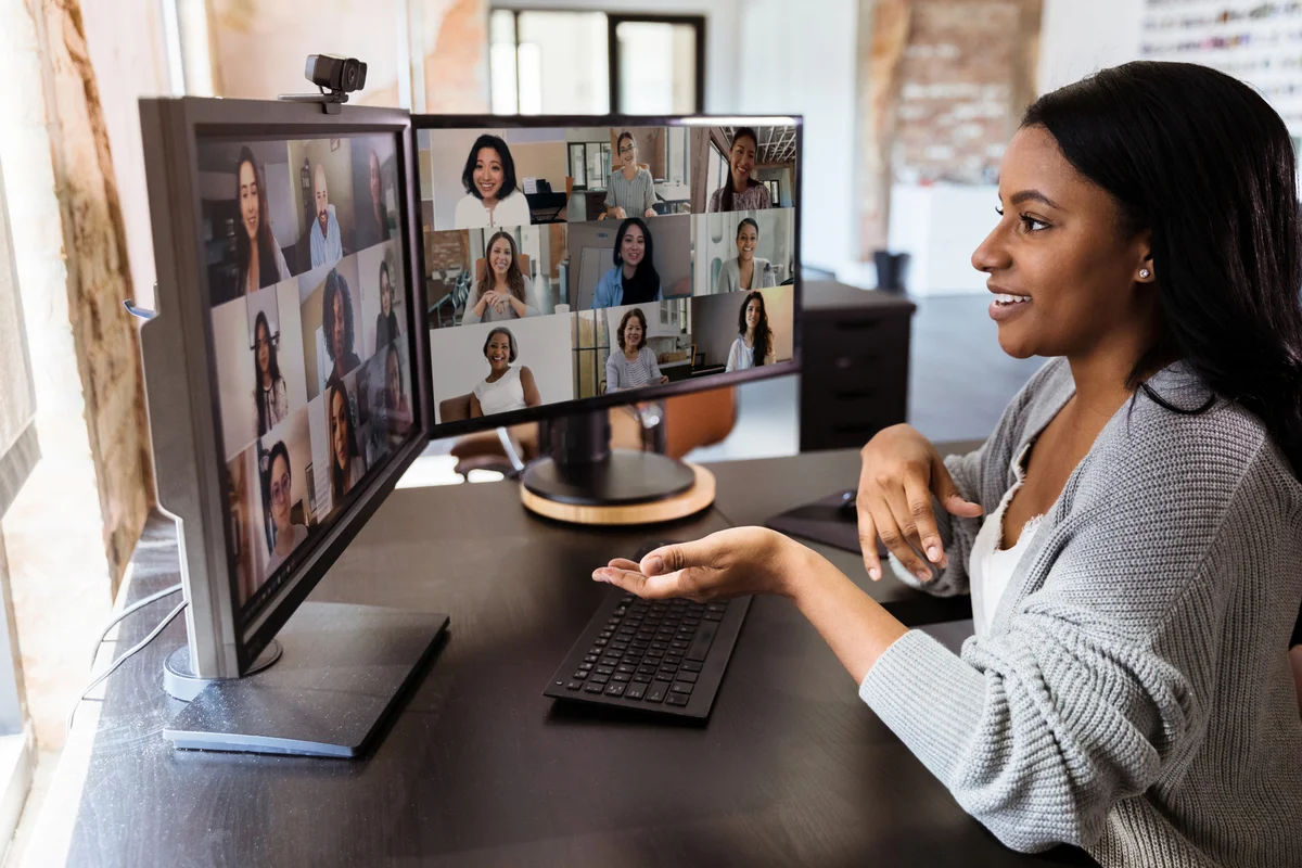 Woman in virtual meeting with colleagues