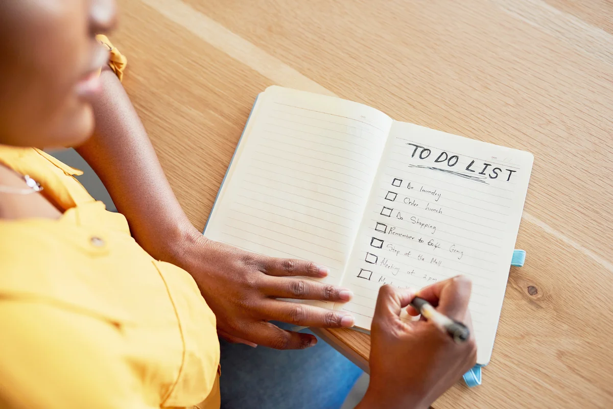 Woman checking off boxes on her to-do list