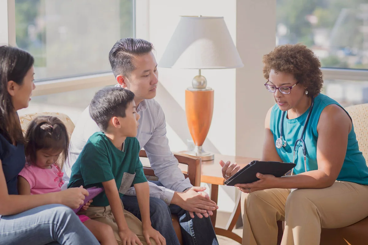 Doctor and patients using digital tablet