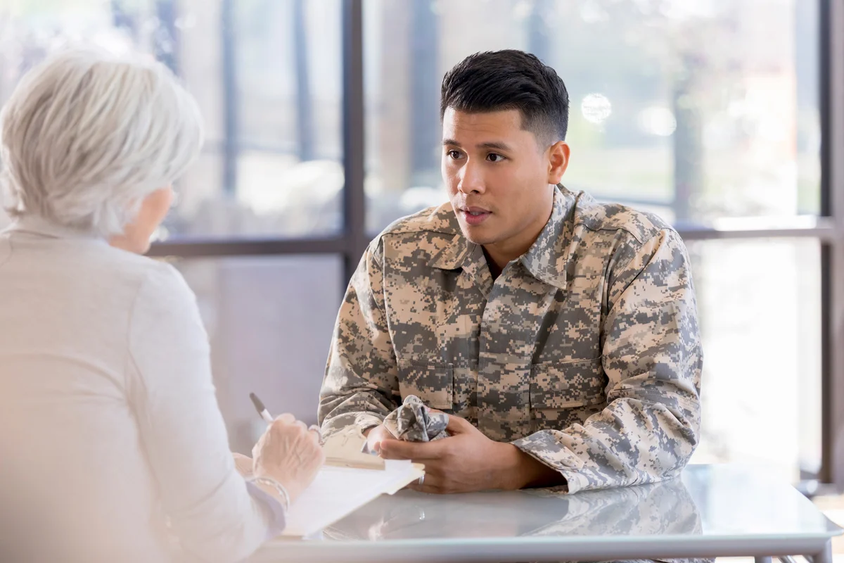 Soldier talks with mental health professional