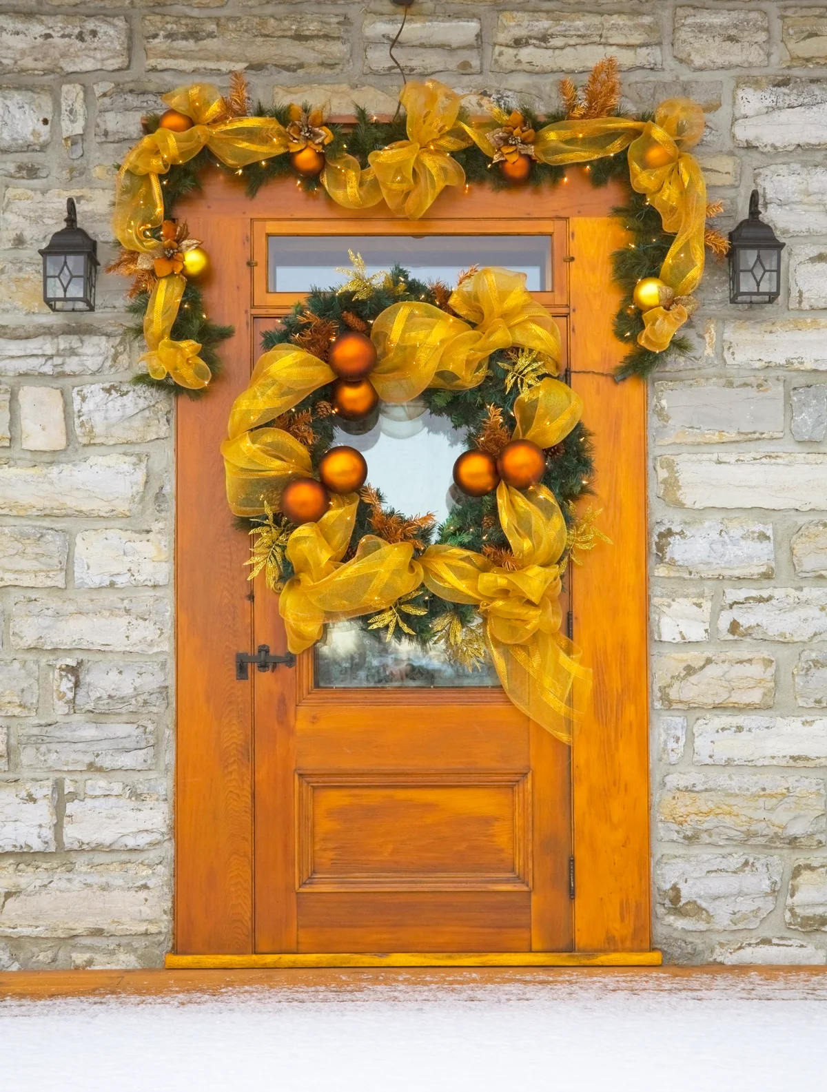 Wooden front entrance door with christmas decorations