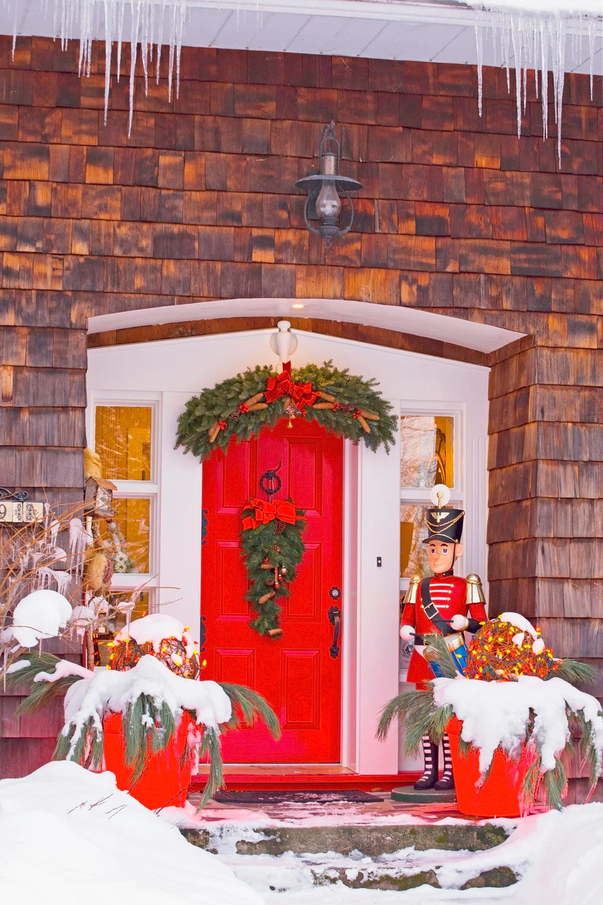 Red Christmas Decorations Around A Front Door