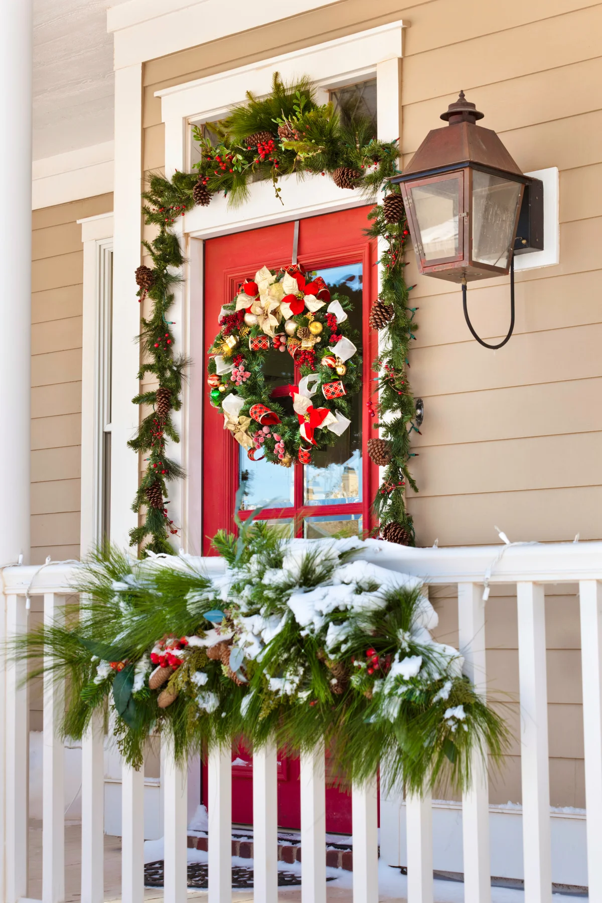 Snow on porch with Christmas decorations
