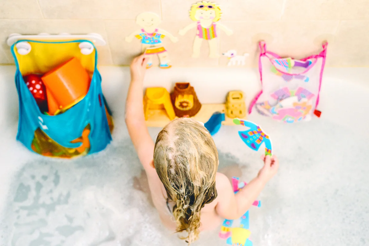 Overhead shot of little girl playing in bath