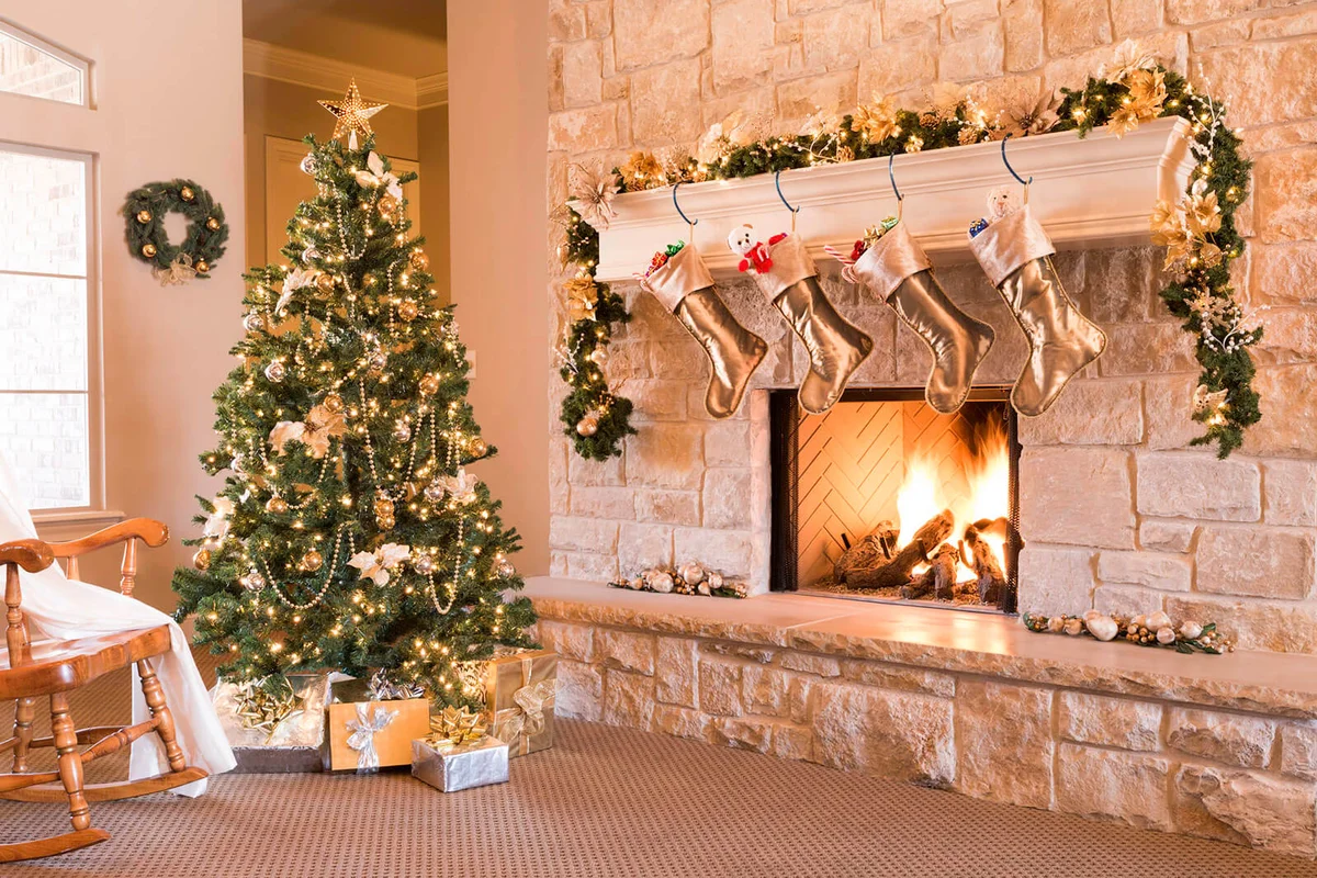 Stockings hanging from mantel by fireplace