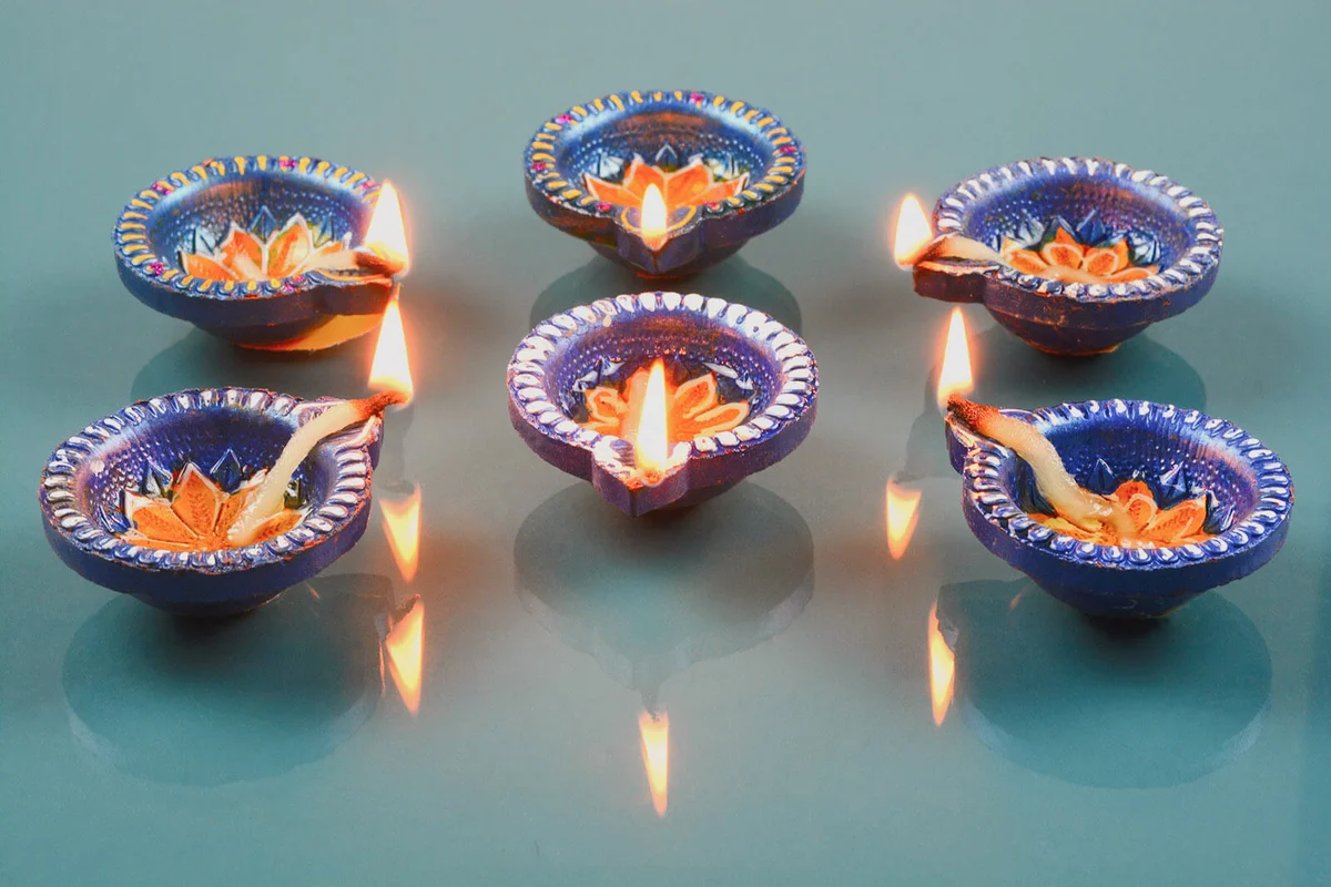Decorated Diwali lights with colorful diya oil lamp