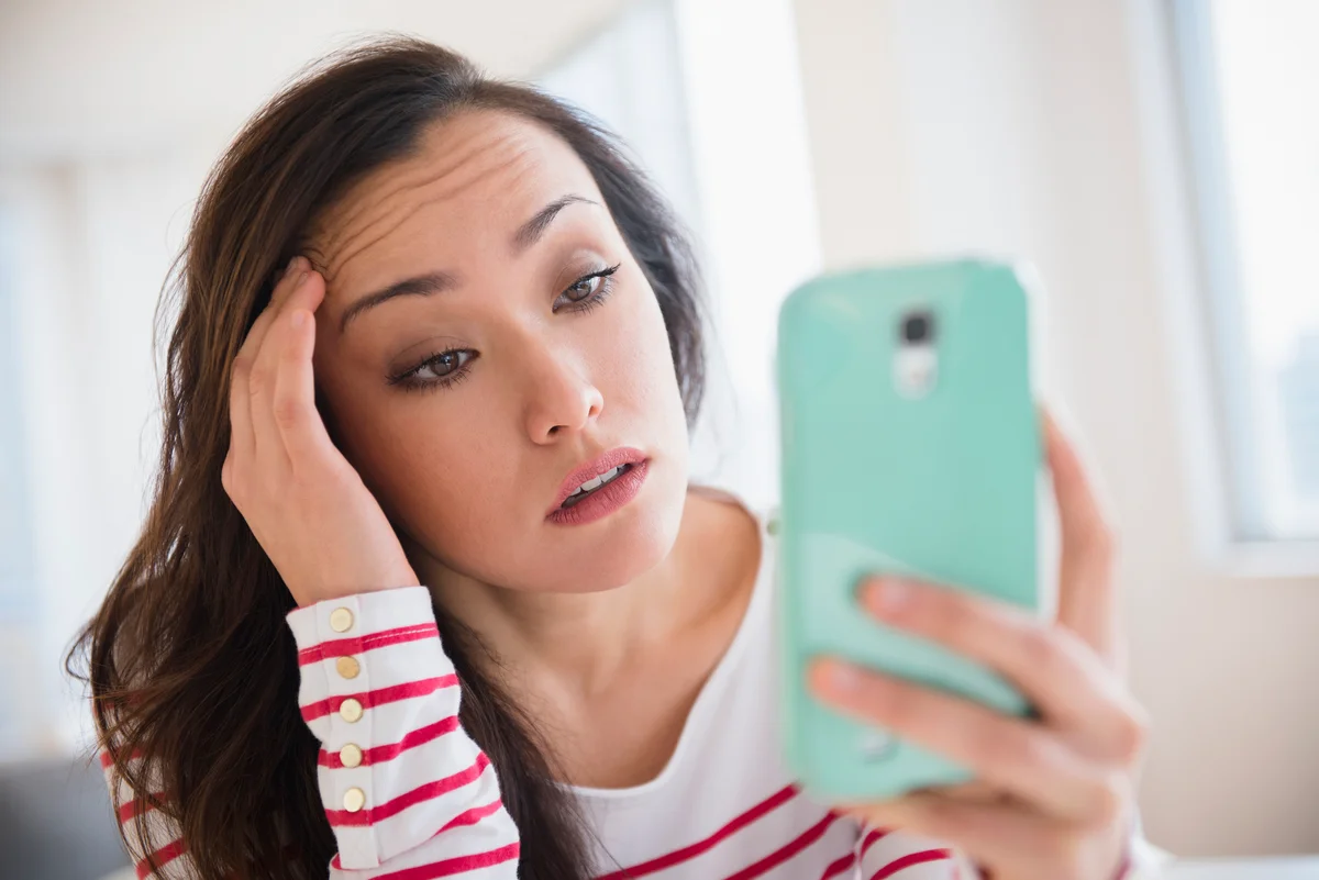 Woman looking at social media on her phone