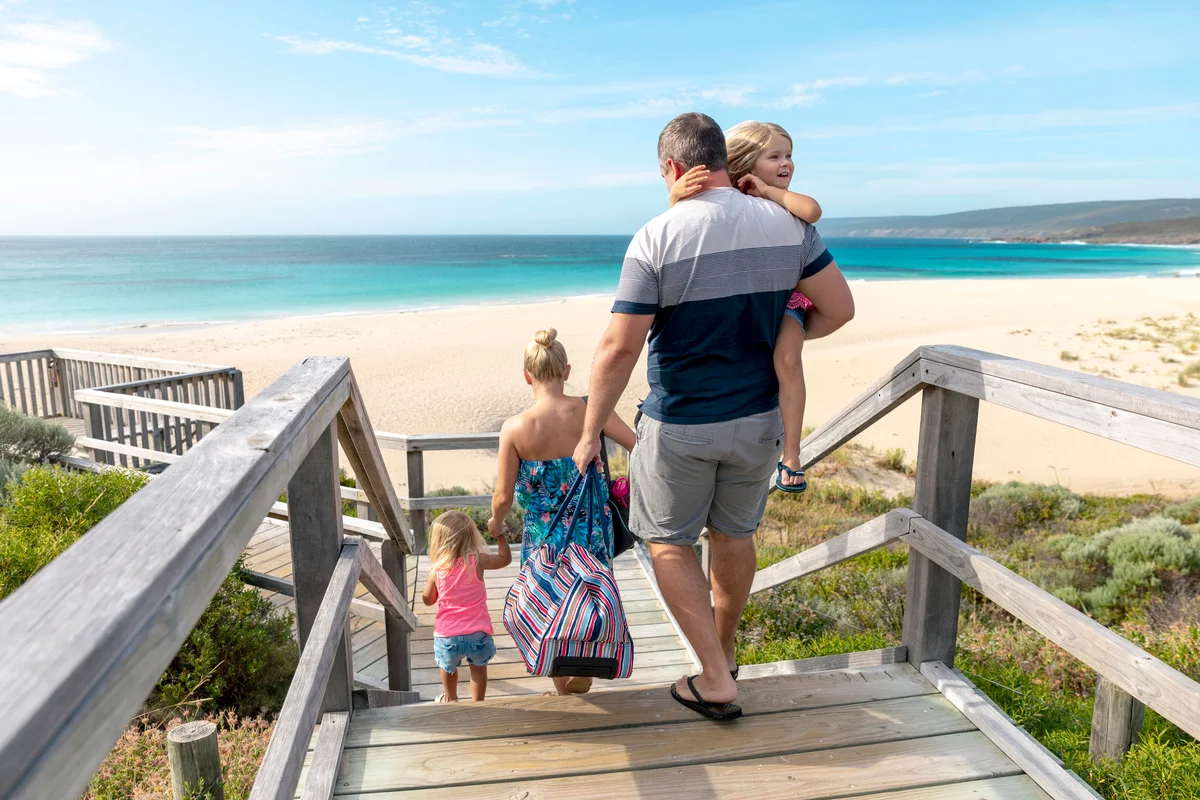Family visiting the beach on a sunny day