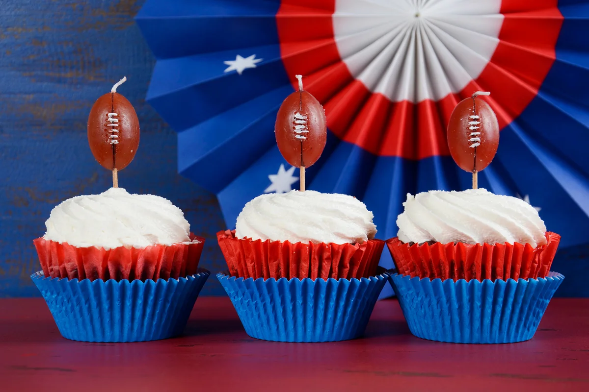 Red, white and blue theme cupcakes with football toppers