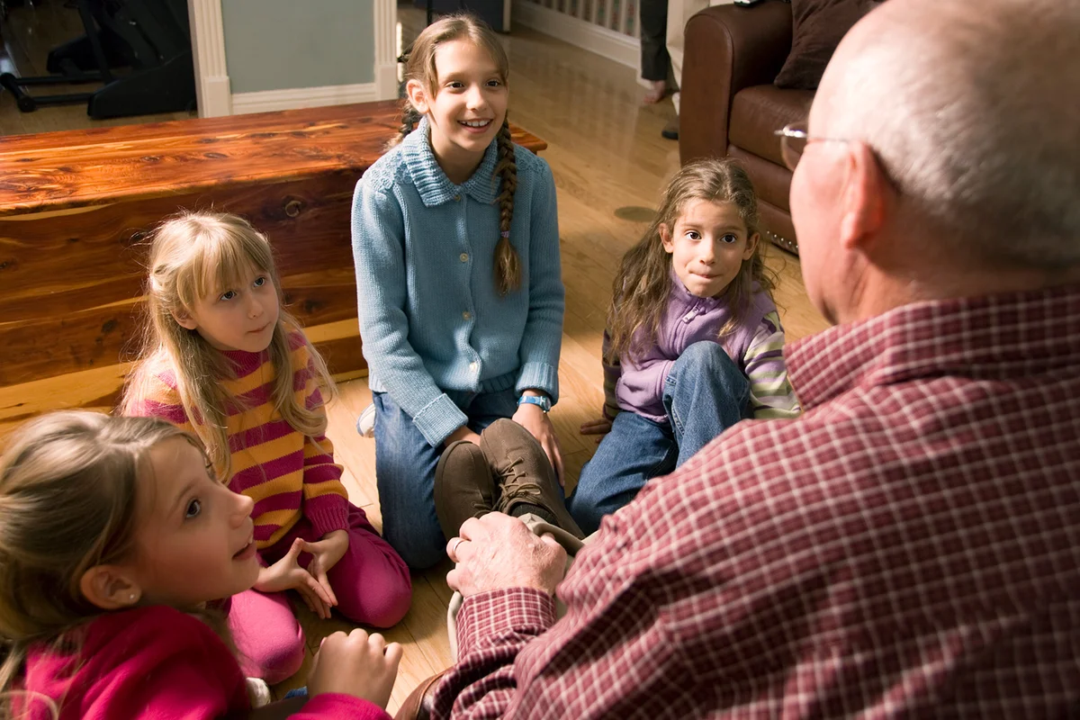 Grandfather telling a story to Grandchildren