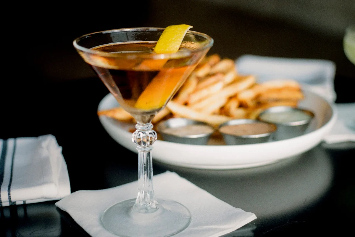 A cocktail and French Fries