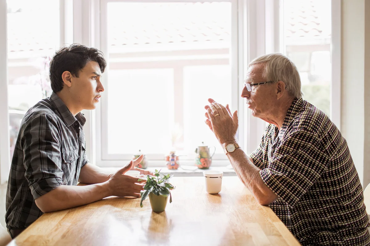 Grandfather and grandson communicating