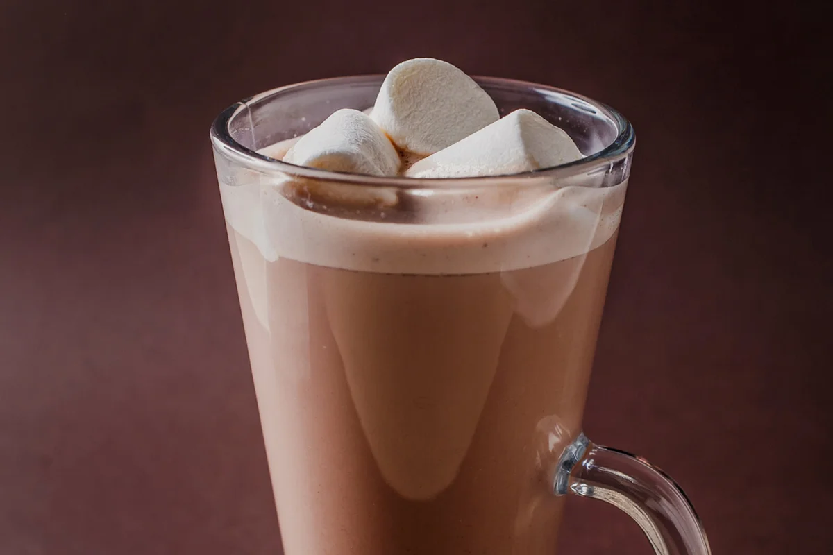 Glass of cacao with three marshmallows