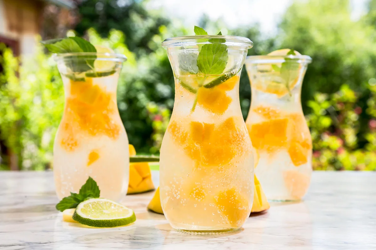 Fruit infused water with mango, lime and lemon