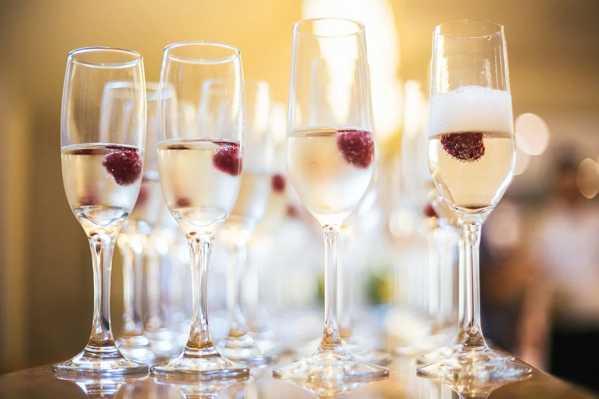 Glasses of champagne with raspberry