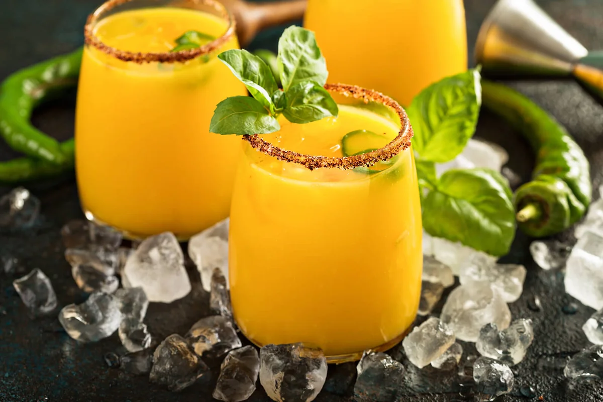 Spicy mango margaritas with basil