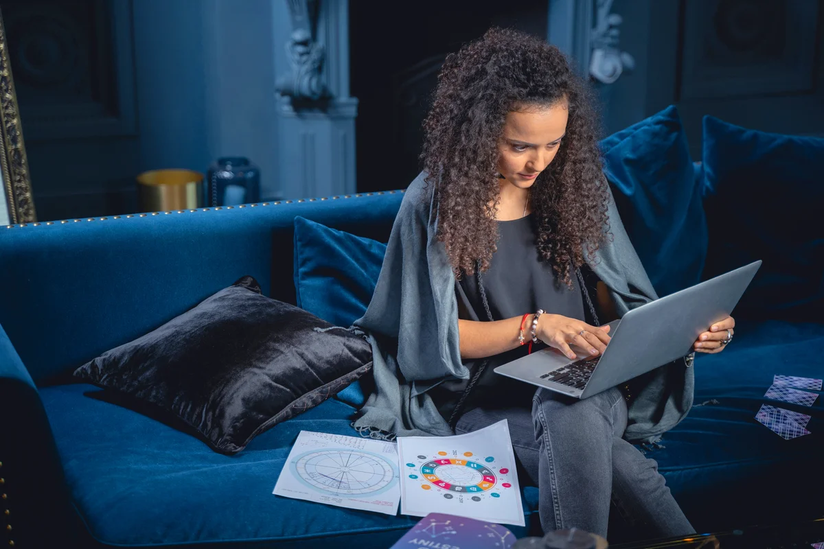 Female astrologer with her laptop