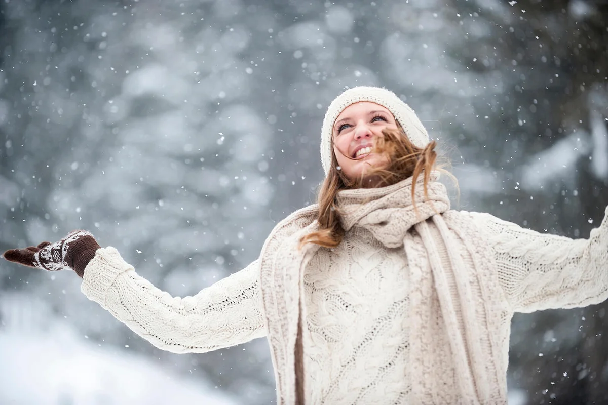 Young woman having fun in snow