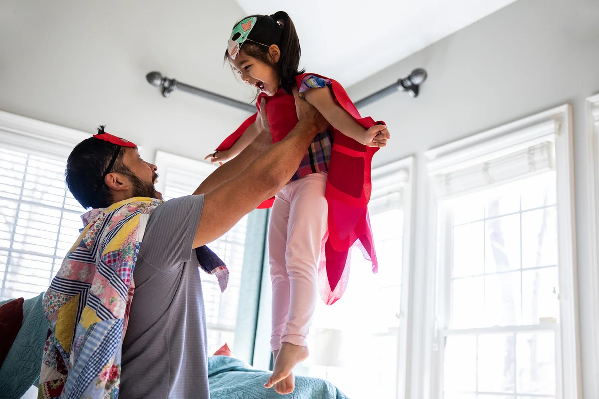Father and daughter playing
