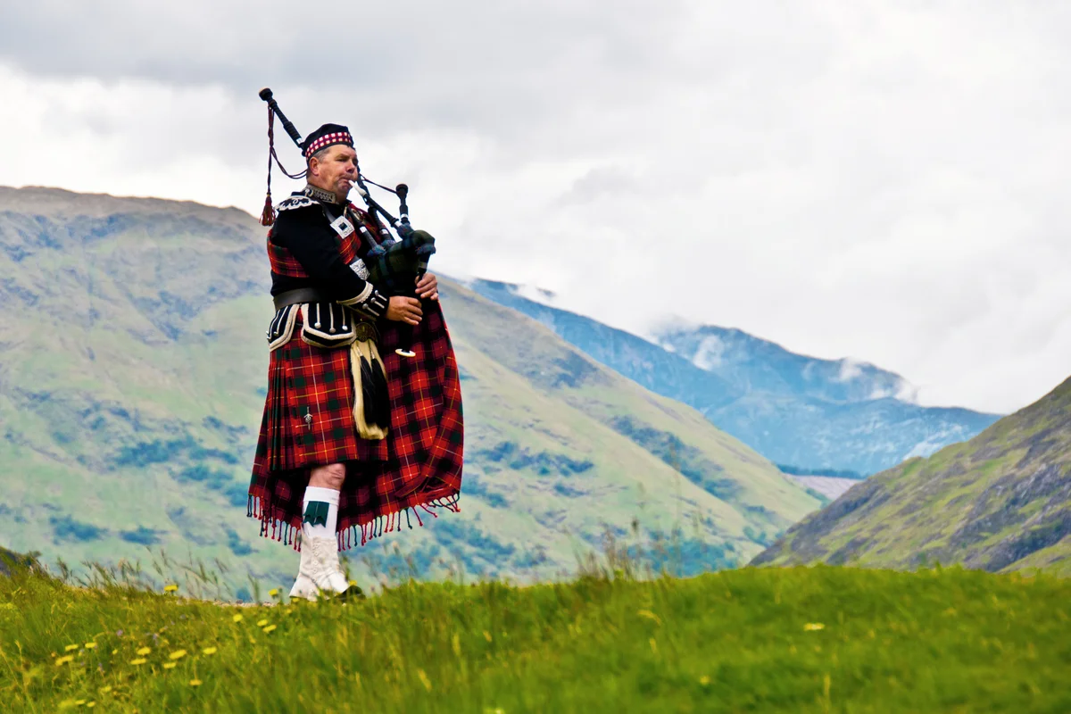 Highland bagpiper in kilt