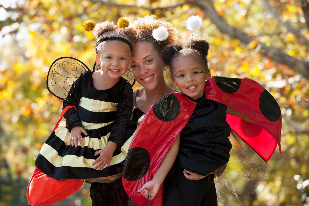 Mother and daughters in Halloween costumes Get Buggy With It