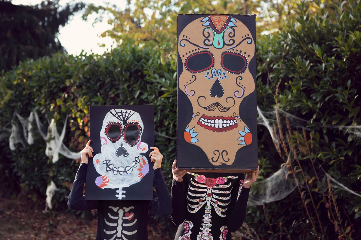 Two children in Halloween costumes Day of the Dead