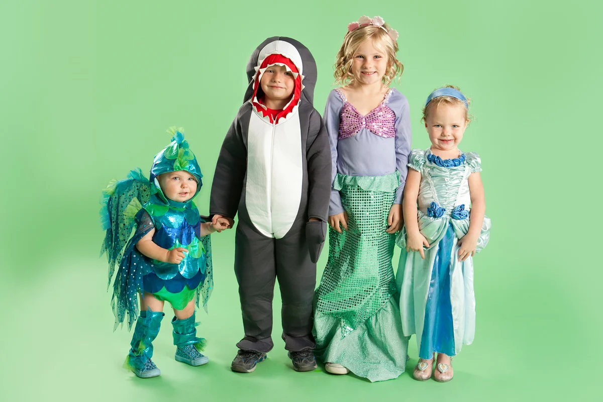 Portrait of children in Mermaid and fish costumes for Halloween