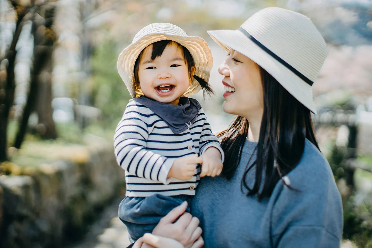 japanese baby girl with mother in park