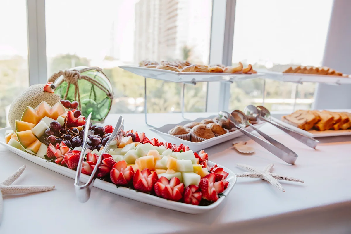 Close up of fruit and muffins at breakfast buffet
