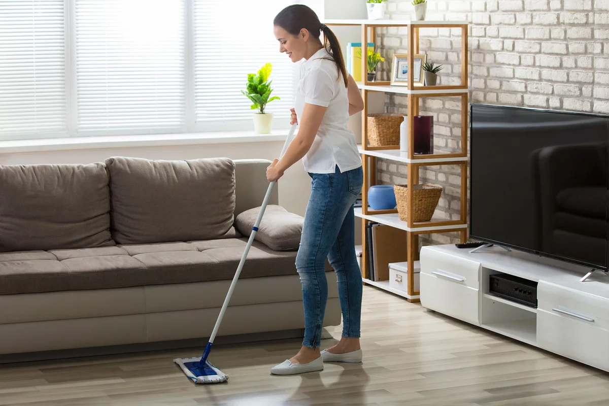 woman mop floor with homemade laminate floor cleaner
