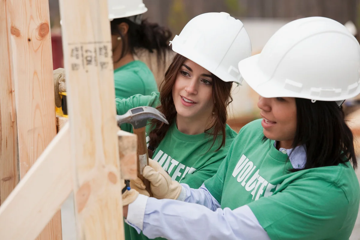 Volunteers working on construction site
