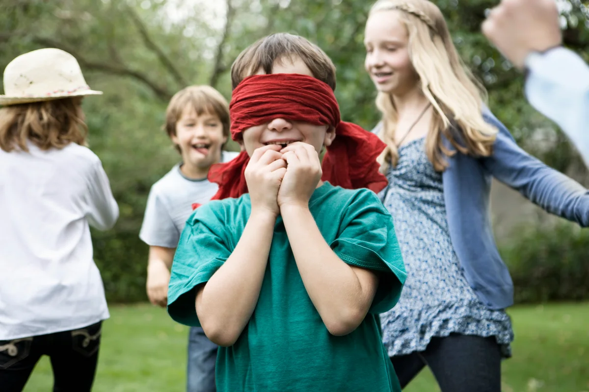 Blindfold kid playing a game