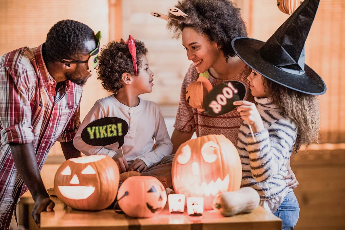 Happy family talking while enjoying Halloween at home
