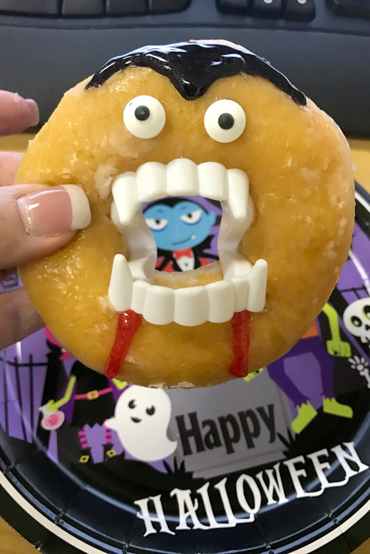 Hand holding monster donut