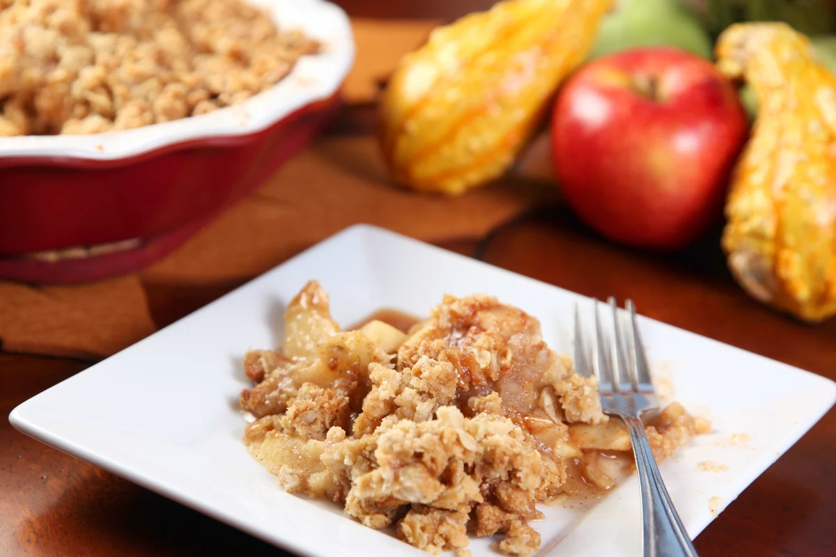A picture of Apple crisp on a white plate
