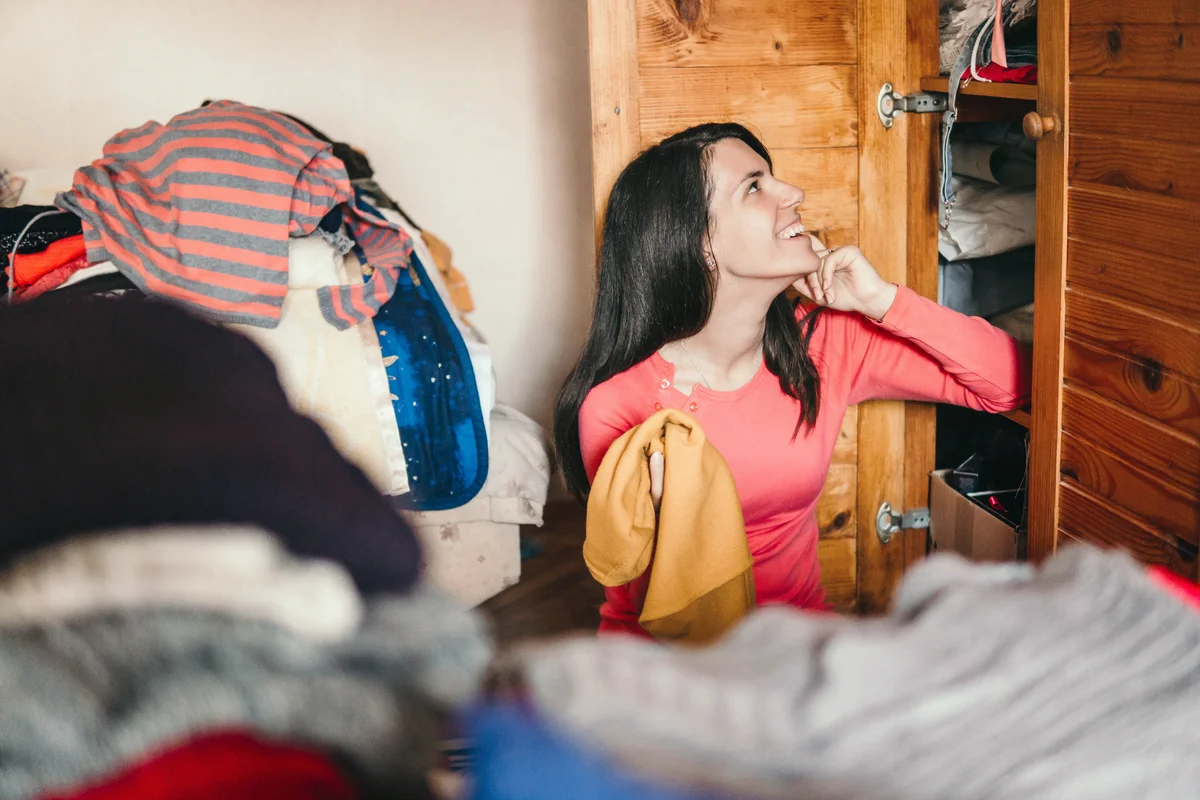 Woman sorting out wardrobe