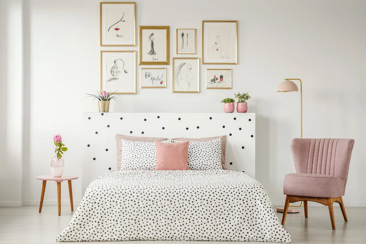 Feminine bedroom interior with posters