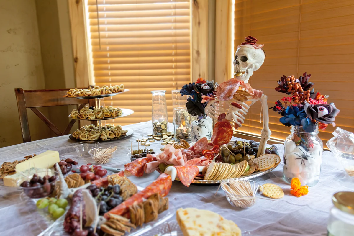 Halloween spread with skeleton centerpiece