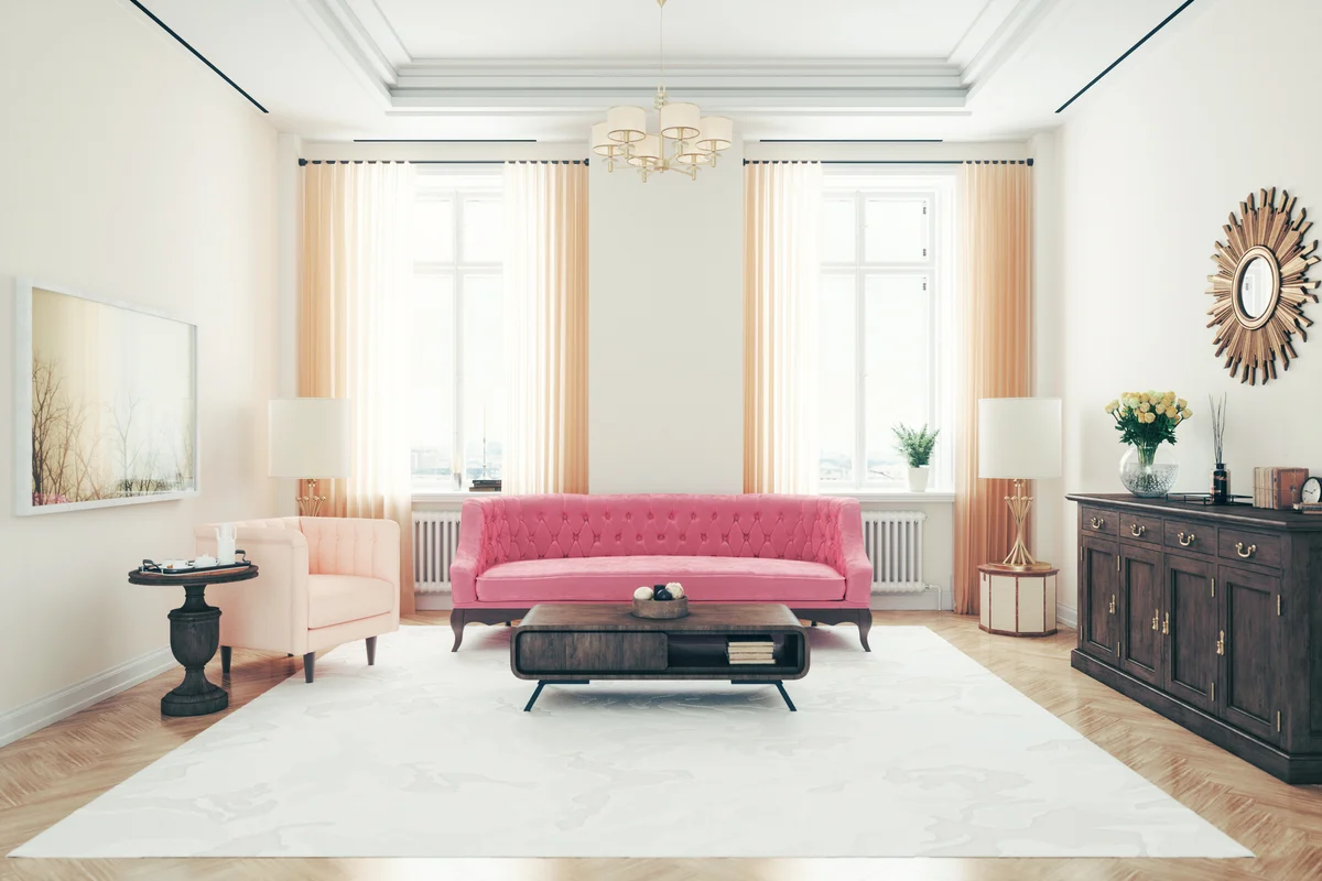 Art deco style living room with pink sofa and armchair