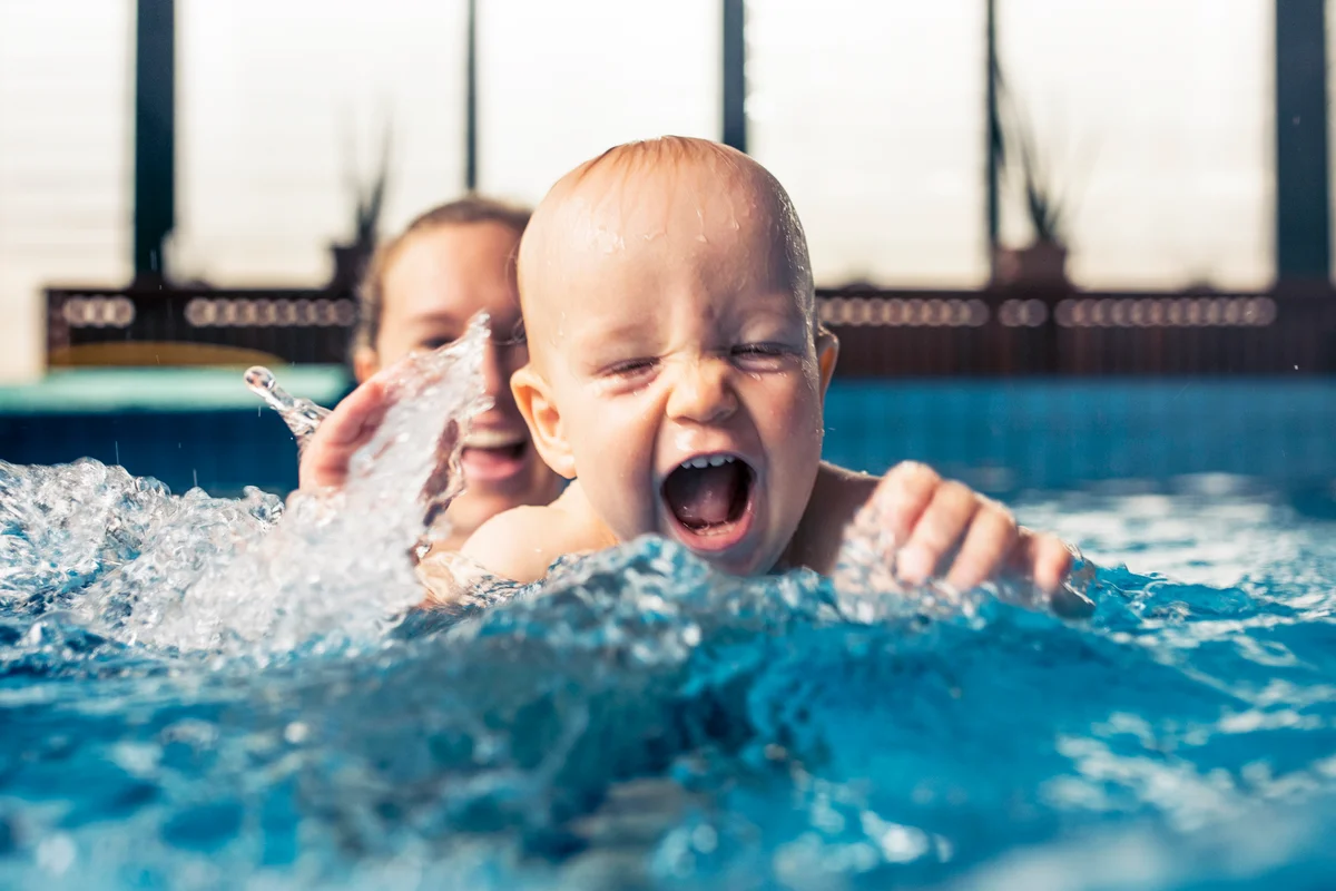 Nine month old baby boy at his first swimming lesson