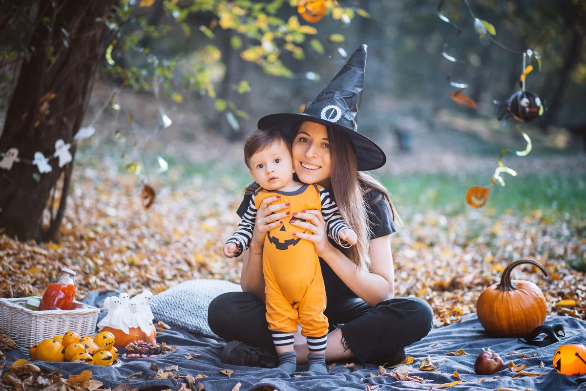 Mother and son at park on picnic during Halloween