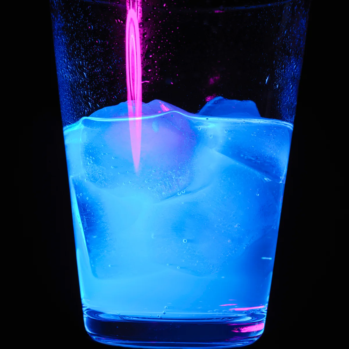 Ultraviolet blue light on drink in glass