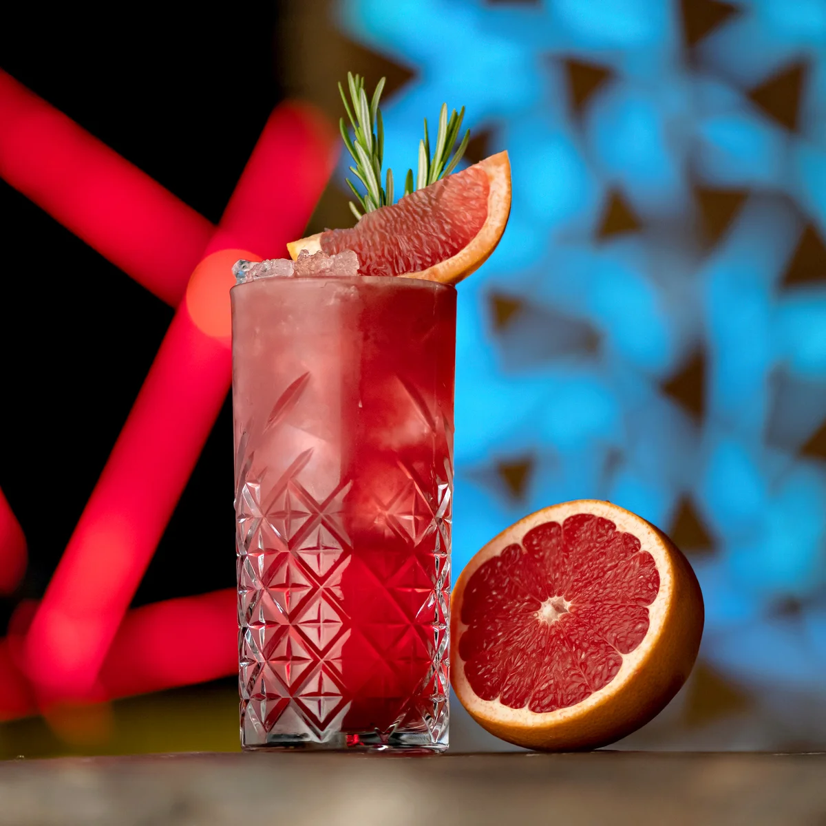 Refreshing Cocktail with ice, rosemary and grapefruit or red sicilian orange
