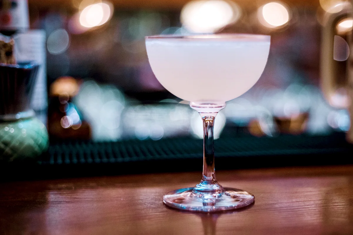 White Cocktail Glass On Table