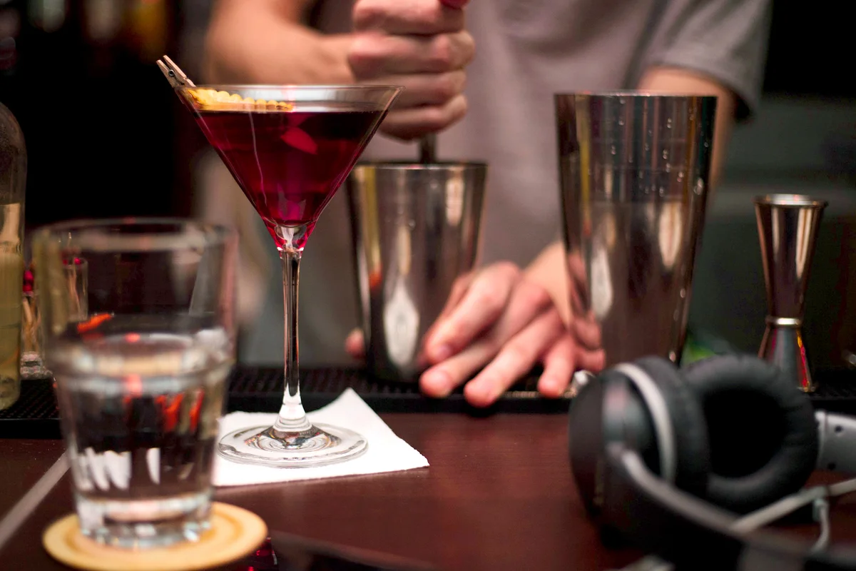Bartender Preparing Drink At Counter