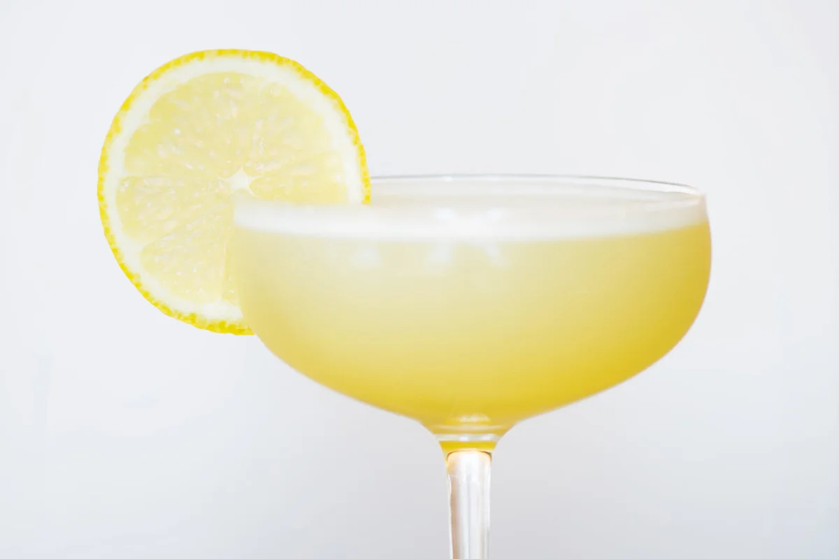 Lemon martini cocktail with a slice of lemon