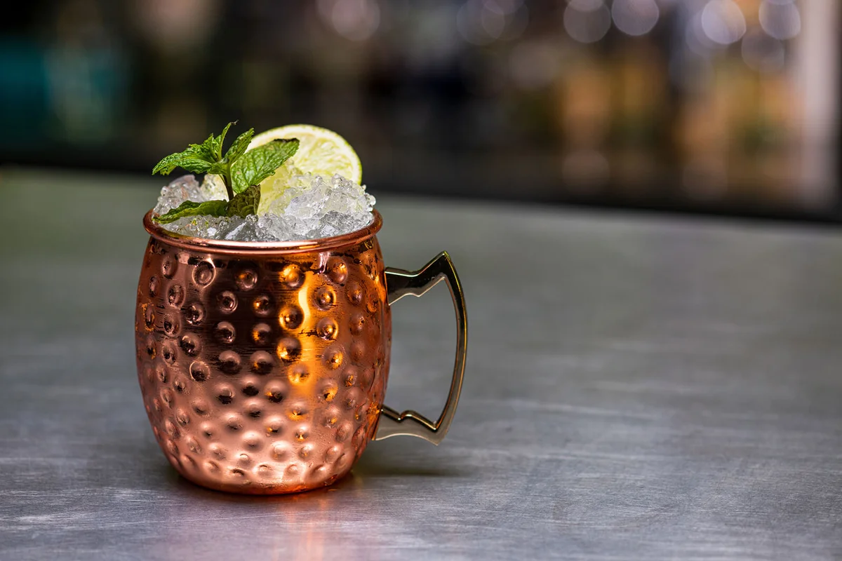 Moscow mule cocktail in traditional copper mug