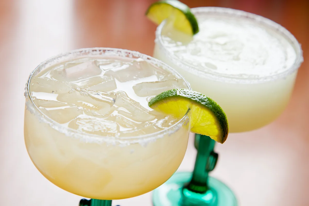 Two glasses of classic margarita: on the rocks and blended