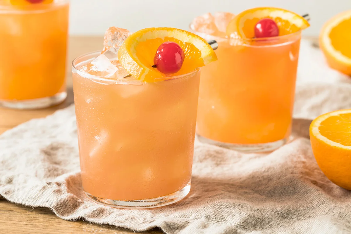 Sweet Alcoholic Rum Swizzle with Orange and PIneapple