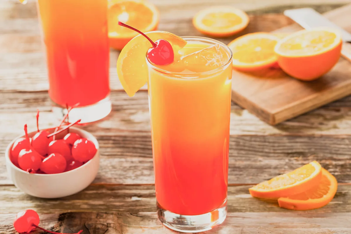 Juicy Orange and Red Tequila Sunrise with a Cherry